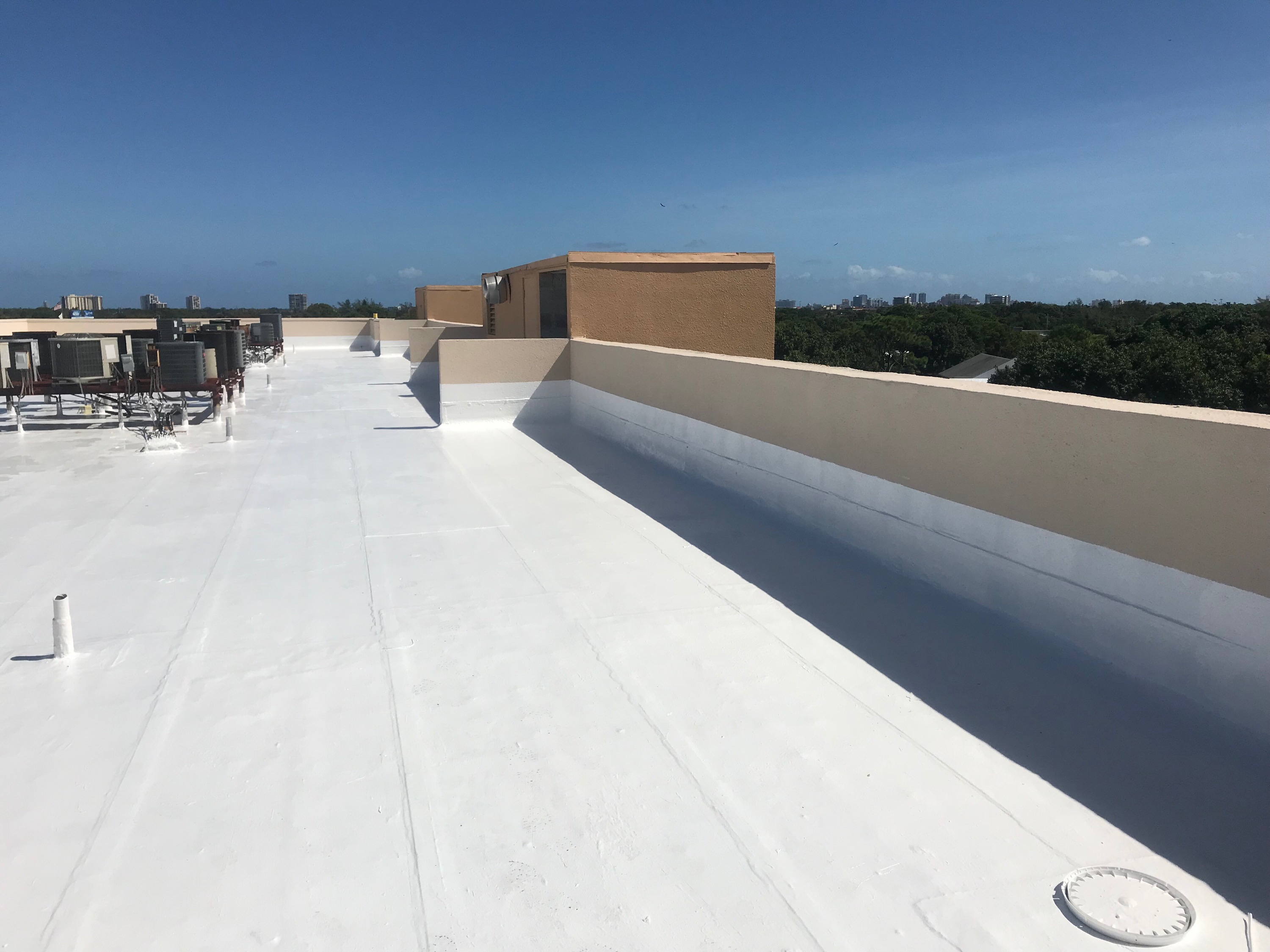 gaco rubberized silicone on a 7th floor apartment-complex flat roof