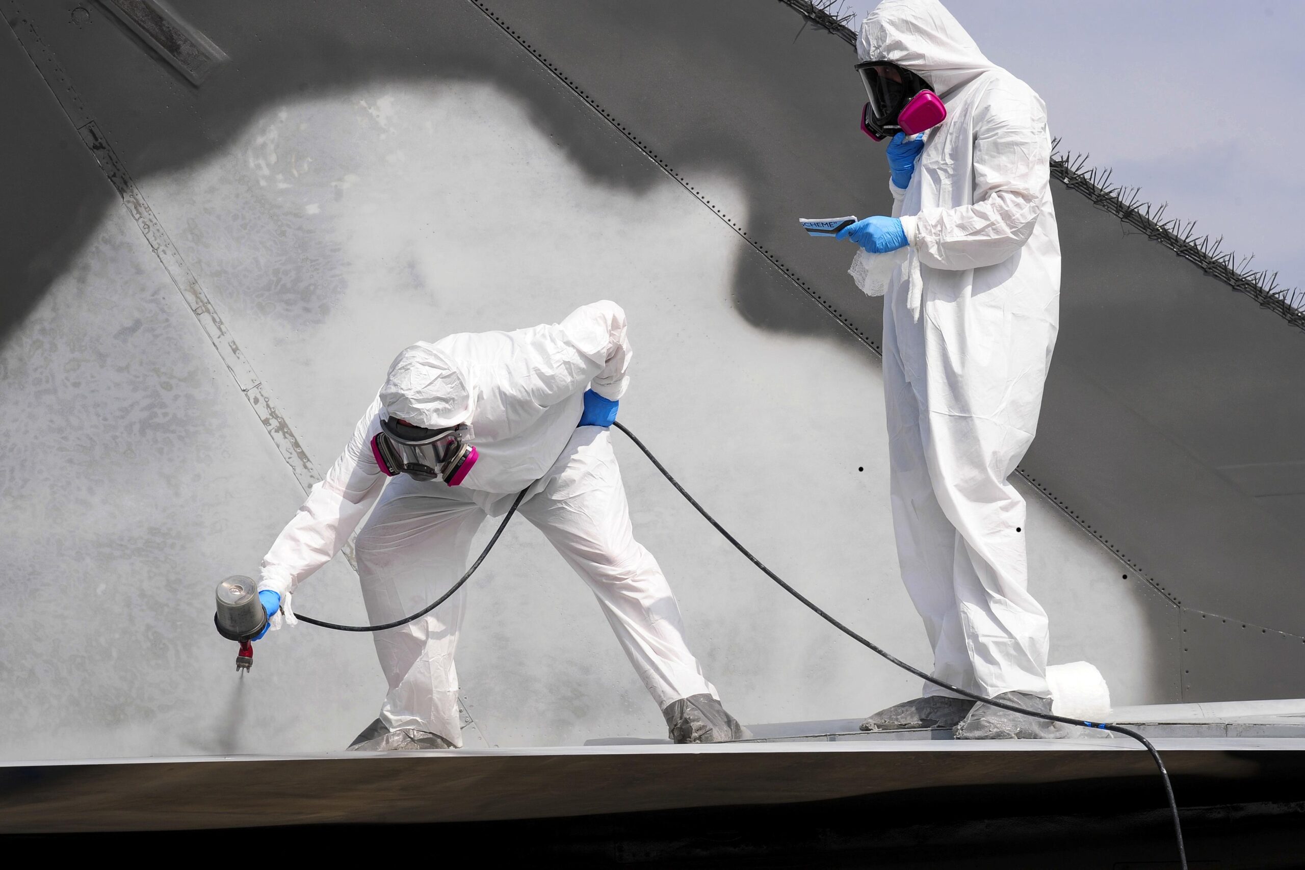 Commercial roof coating application by US Coating Specialists crew in Florida