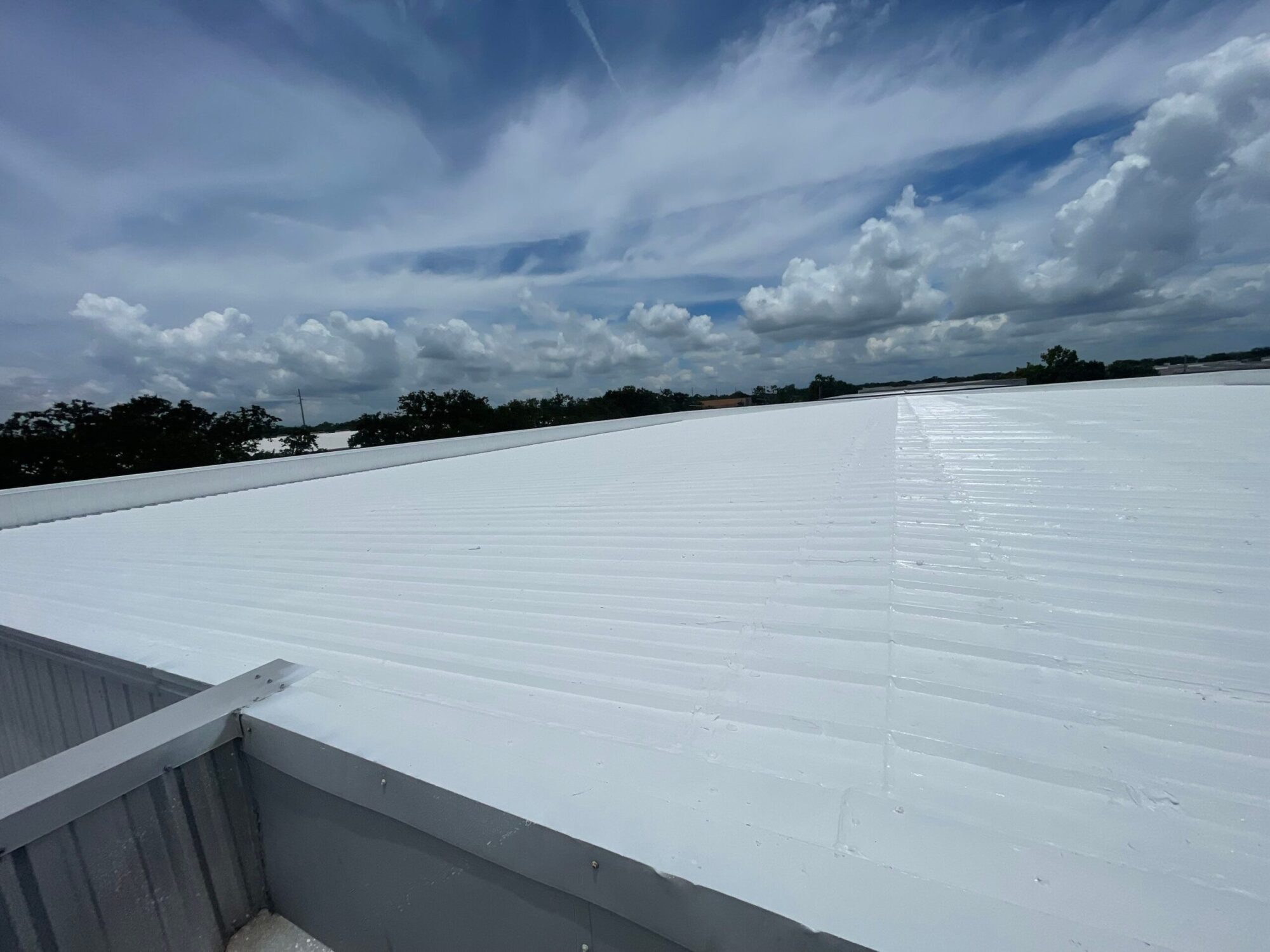 Commercial Metal Roof Coatings Florida: How Coastal Salt Air Destroys Metal Roofs (And How Protective Coatings Stop It), Port St Lucie metal roof coating services, Tampa silicone roof coating installation